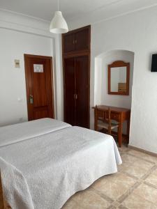 Postel nebo postele na pokoji v ubytování Hostal Barbate
