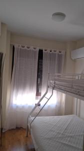 Ένα ή περισσότερα κρεβάτια σε δωμάτιο στο Campanilla n`28 +4 φωτογραφίες