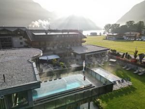 an aerial view of a hotel with a swimming pool at Hotel Wagnerhof in Pertisau