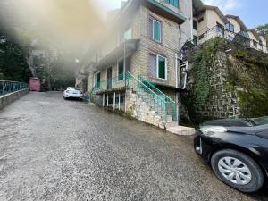 a car parked in front of a building at Misty Mountain in Murree