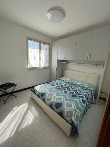 Postel nebo postele na pokoji v ubytování Serenity House 80mq vista mare