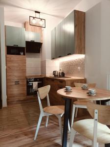 Kuchyňa alebo kuchynka v ubytovaní Apartament w sercu Gdańska