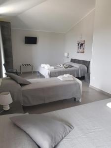 A bed or beds in a room at Un passo dal mare - Guest House