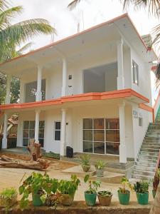 a house with plants in front of it at Ocean Hill in Arugam Bay