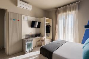 Postel nebo postele na pokoji v ubytování Hotel Nina + 37 fotografií