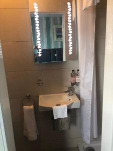 a bathroom with a sink and a mirror at Seacrest B&B in Galway +56 photos