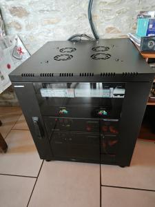 a computer tower sitting on top of a floor at Chambres Les Salles in Beauvoir