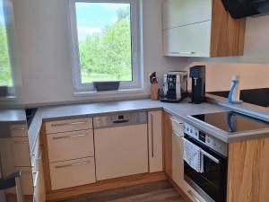 Kuchyň nebo kuchyňský kout v ubytování Ferienwohnung Sandra