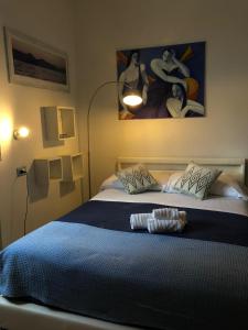 Säng eller sängar i ett rum på La Favorita Hotel