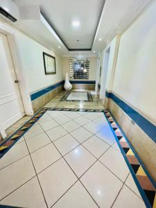 a hallway with a tiled floor in a house at Spectacular Condominium between the city and the sea in Santo Domingo