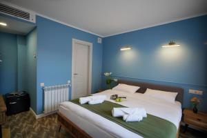 Postel nebo postele na pokoji v ubytování Station 22 Hotel