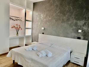 Postel nebo postele na pokoji v ubytování Hotel Il Moro