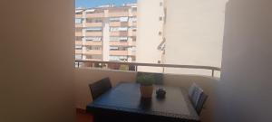 a table and chairs in a room with a window at luxury homes Marbella sun beach and pool in Marbella