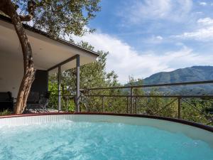 a hot tub in the backyard of a house at De Vivo Realty - Regina Vittoria Relais EcoSmart Luxury Home SPA in Vico Equense