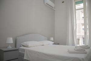 Postel nebo postele na pokoji v ubytování Don Giovanni a Toledo Apartment