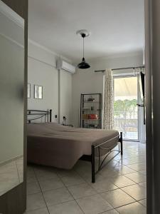 Ένα ή περισσότερα κρεβάτια σε δωμάτιο στο Iris Apartment Nafpaktos
