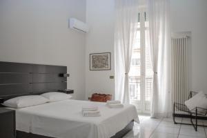 Postel nebo postele na pokoji v ubytování Don Giovanni a Toledo Apartment