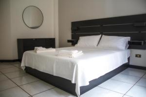 Postel nebo postele na pokoji v ubytování Don Giovanni a Toledo Apartment