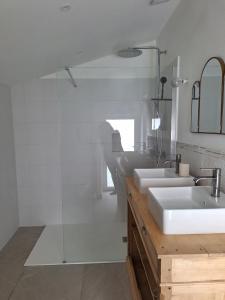 a bathroom with three sinks and a mirror at Au Cœur Des Champs in La Petite-Boissière +24 photos