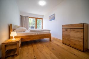 Postel nebo postele na pokoji v ubytování Lipno Port Apartment C203 - Lipno Home