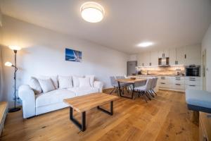 Kuchyň nebo kuchyňský kout v ubytování Lipno Port Apartment C203 - Lipno Home + 16 fotografií