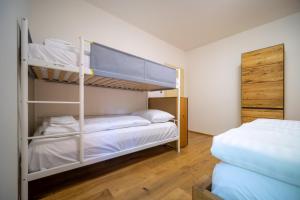 Postel nebo postele na pokoji v ubytování Lipno Port Apartment C203 - Lipno Home
