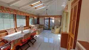 a living room with a table and a couch at Villino Fatima in Crotone