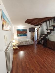a living room with a staircase and a couch at Casa Paradiso in Chieti +16 photos