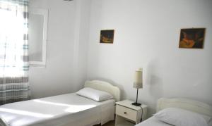 Postel nebo postele na pokoji v ubytování Konstantina Apartment