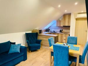 Χώρος καθιστικού στο Apartament turkusowy