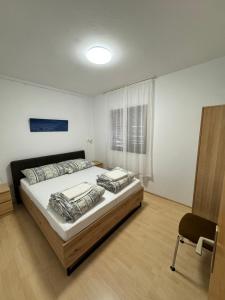 Ένα ή περισσότερα κρεβάτια σε δωμάτιο στο Apartman Silo