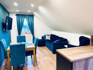 Χώρος καθιστικού στο Apartament turkusowy