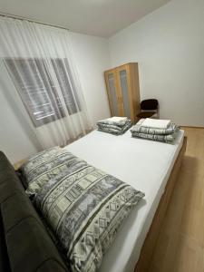 Ένα ή περισσότερα κρεβάτια σε δωμάτιο στο Apartman Silo