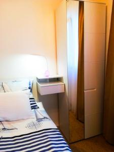 Postel nebo postele na pokoji v ubytování Felix Apartment Biograd