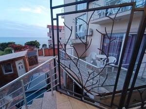 a balcony with a view of the ocean at Aparthotel Villa Maja in Gornji Sušanj