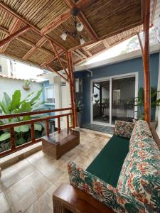 a living room with a couch and a table at Cal Bed & Breakfast Ibague in Ibagué