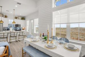 a kitchen and dining room with a table and chairs at Ocean Pearl at Palmilla Beach in Port Aransas