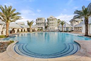 a large swimming pool in front of a building at Ocean Pearl at Palmilla Beach in Port Aransas