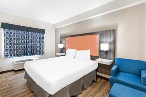 The Waves Hotel, Ascend Hotel Collection客房内的一张或多张床位