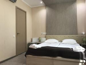 Voodi või voodid majutusasutuse Tbiliseli Inn toas