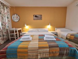 Ein Bett oder Betten in einem Zimmer der Unterkunft Villa HAUS NIKO