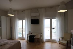TV a/nebo společenská místnost v ubytování Hotel Concordia