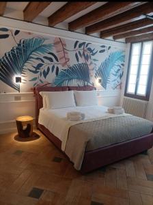 Voodi või voodid majutusasutuse Locanda Ca' Leon - Ferretti Hotels Collection toas