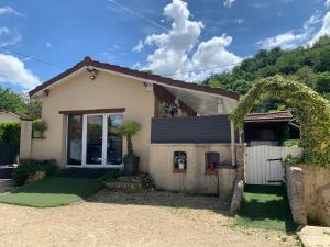 a house with a green lawn in front of it at La Bergerie in Thodure
