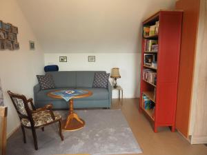 a living room with a couch and a table at Ferienwohnung "In der Argenschleife" in Wangen im Allgäu