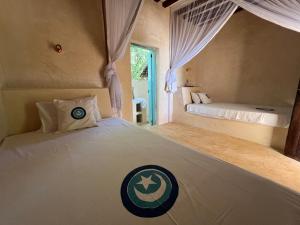 Voodi või voodid majutusasutuse The Cabanas Lamu toas
