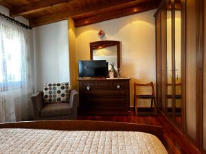 TV a/nebo společenská místnost v ubytování B&B Casa del Conte