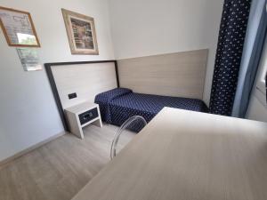 Postel nebo postele na pokoji v ubytování Alloggi Pontecorvo Liviana