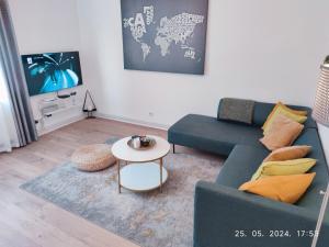 a living room with a couch and a table at Lumani Apartment Zagreb with FREE Parking in Zagreb