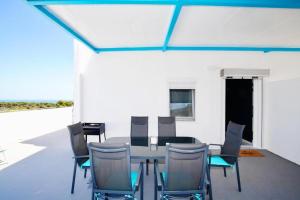 a dining room with a table and chairs at ML Apartments in Vieste